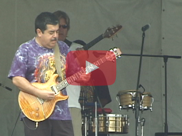 Play button showing musician Antonio Marquez playing electric guitar